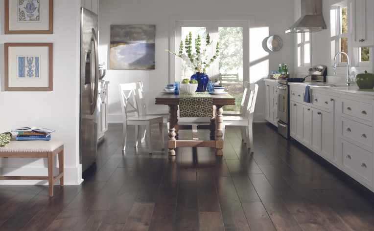 rich dark hardwood floors in white modern kitchen with blue accents